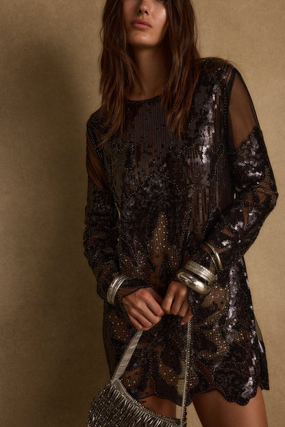 Close-up of the Amber Nights Black Beaded Mini Dress showcasing the beaded texture and craftsmanship.