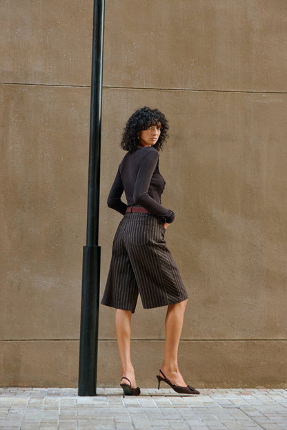 Asymmetrical buttoned top