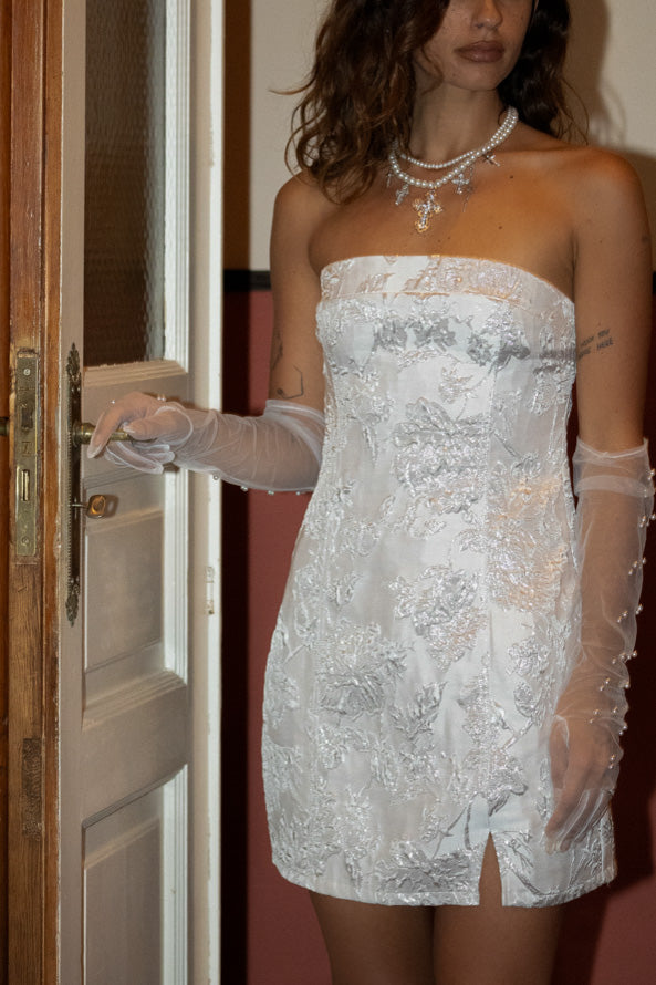 Close-up of the Bellini Silver Strapless Floral Mini Dress showcasing the fabric texture and design details.