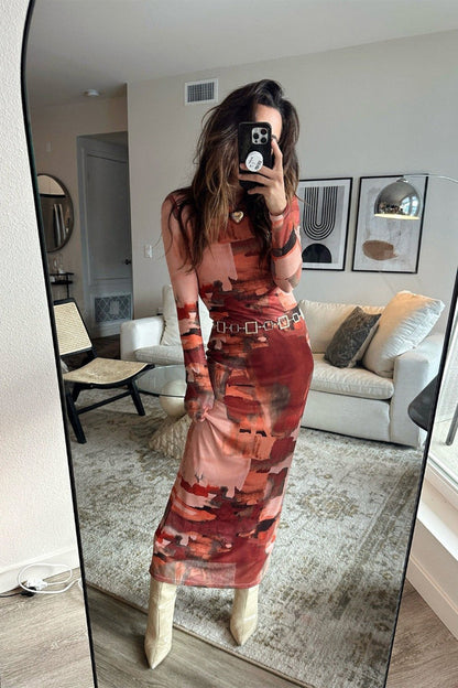 Mesh maxi dress with detailing and a flattering silhouette.