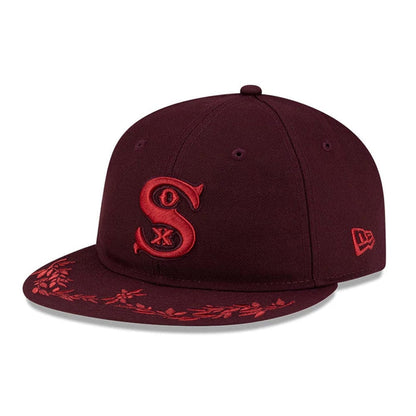 Pictured is this MLB Flourishes Chicago White Sox Retro Crown 9FIFTY cap in dark purple. 3