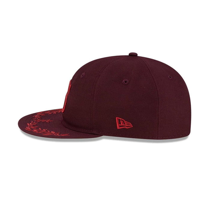 Pictured is this MLB Flourishes Chicago White Sox Retro Crown 9FIFTY cap in dark purple. 5