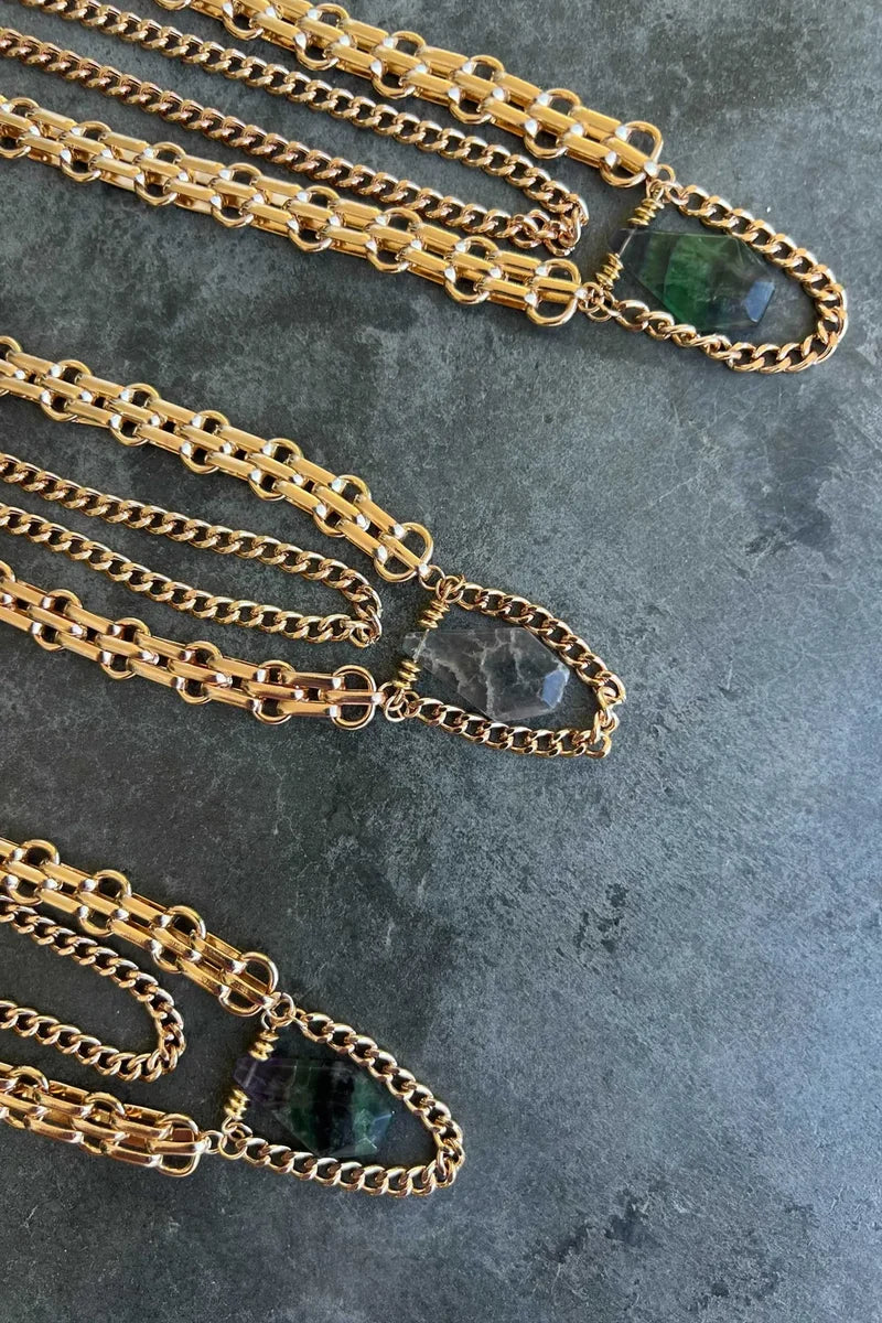 Emerson Necklace shown from a different angle, highlighting the metalwork details.