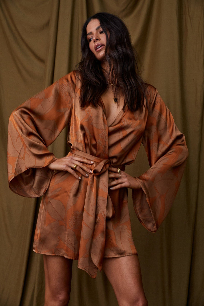 Back view of the rust dress showing the silhouette and fit.