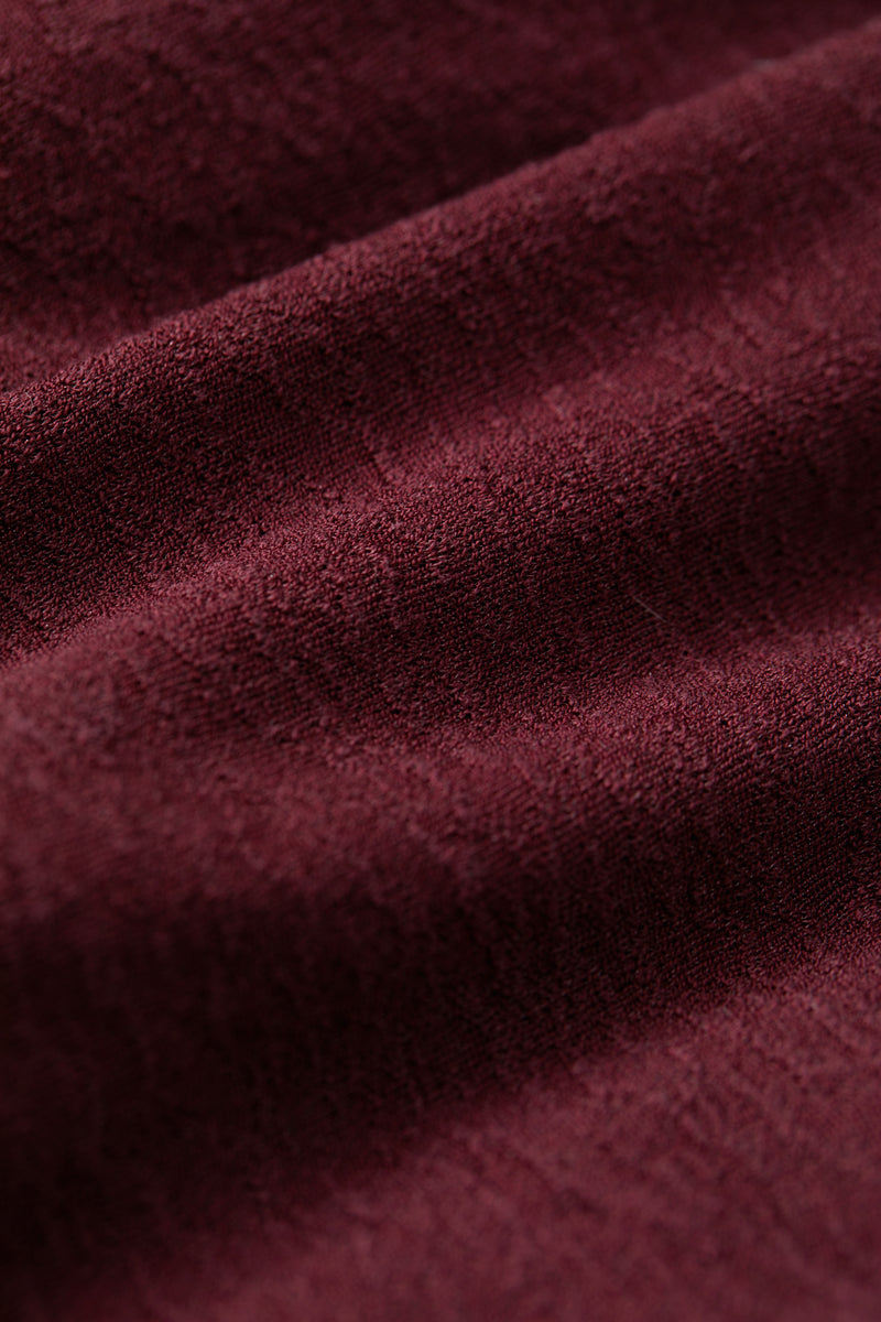 Halterneck pleated bubble hem dress