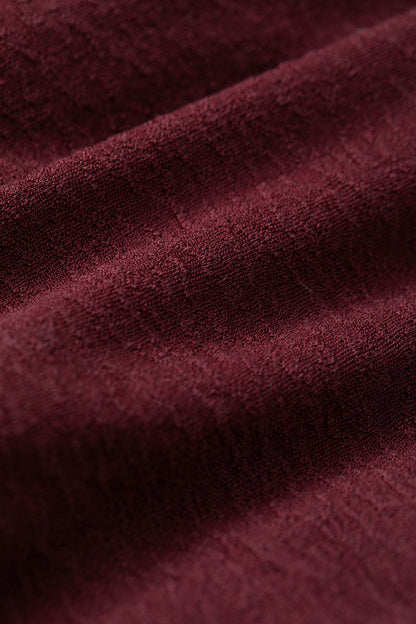 Halterneck pleated bubble hem dress