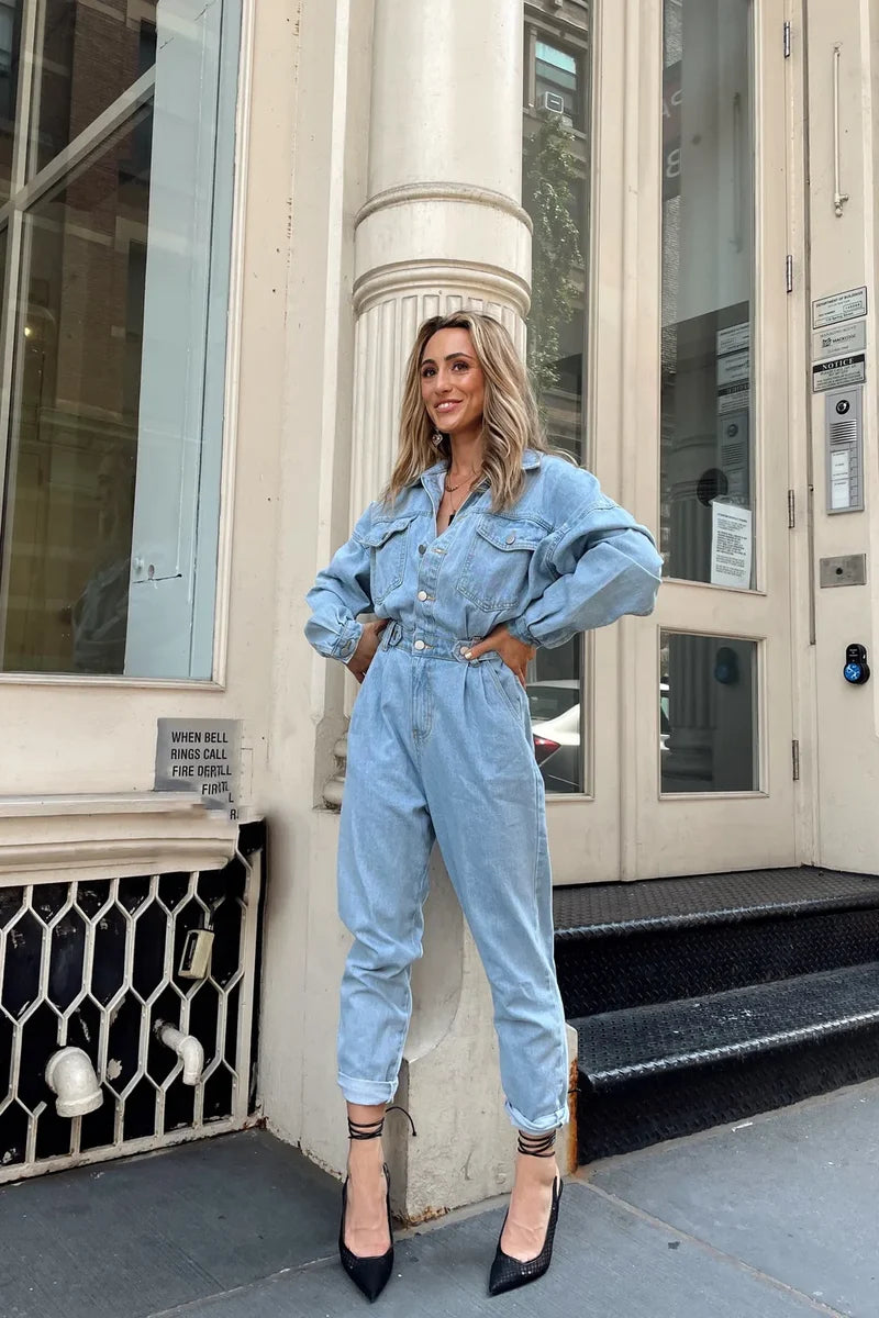 Back view of the denim jumpsuit showing the silhouette and fit.
