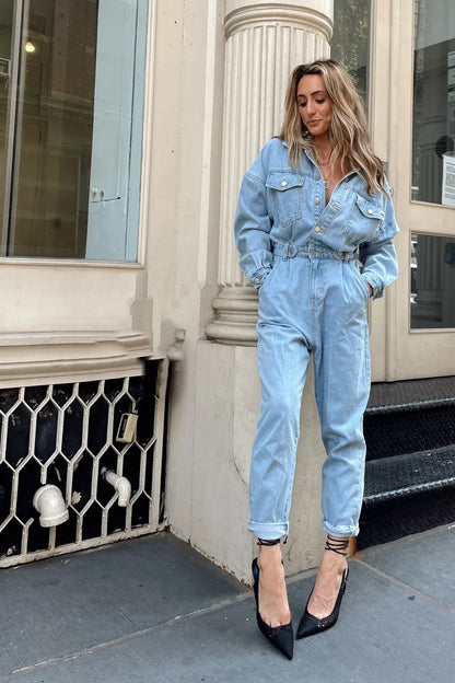 Full-length view of the jumpsuit showing the drape and movement.
