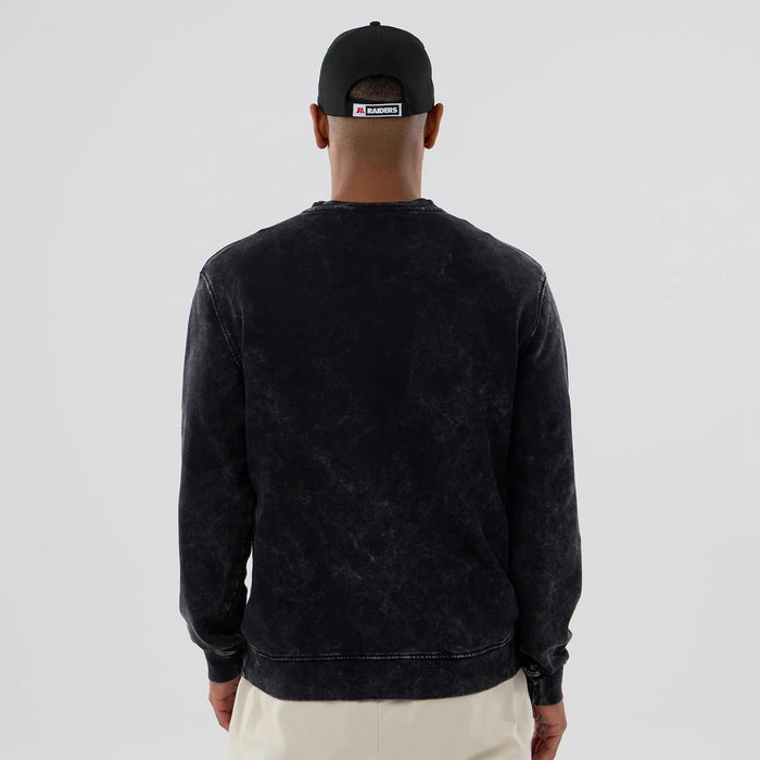 The model is wearing this NFL Las Vegas Raiders Laurel Wreath Crew Neck Sweater in black. 2