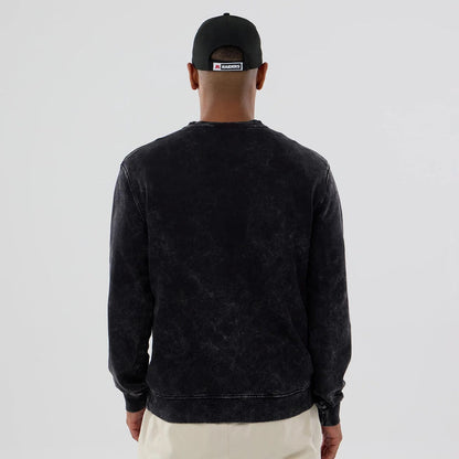The model is wearing this NFL Las Vegas Raiders Laurel Wreath Crew Neck Sweater in black. 2