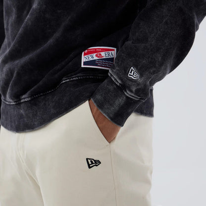 The model is wearing this NFL Las Vegas Raiders Laurel Wreath Crew Neck Sweater in black. 5