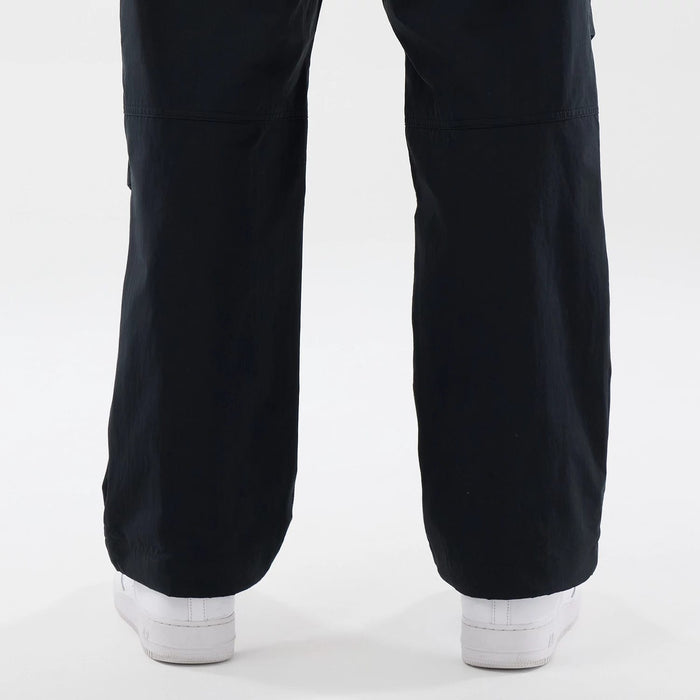 The Male model is wearing New Era Organic Black Parachute Trousers 7