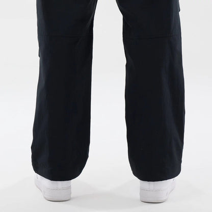 The Male model is wearing New Era Organic Black Parachute Trousers 7