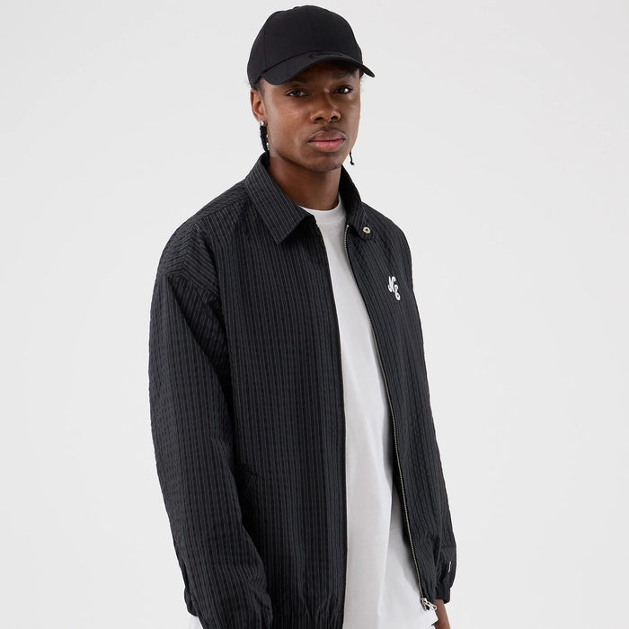 The model is wearing this New Era Street Class jacket in navy. 1