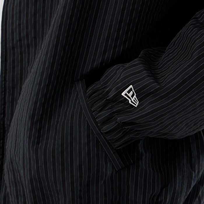 The model is wearing this New Era Street Class jacket in navy. 5