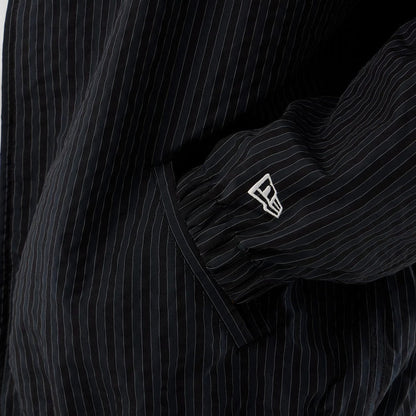 The model is wearing this New Era Street Class jacket in navy. 5