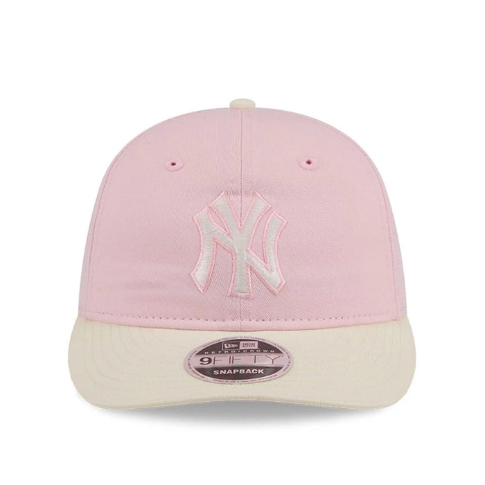 Pictured is this MLB Washed Tie Dye New York Yankees 9FIFTY Snapback cap in pastel pink. 2