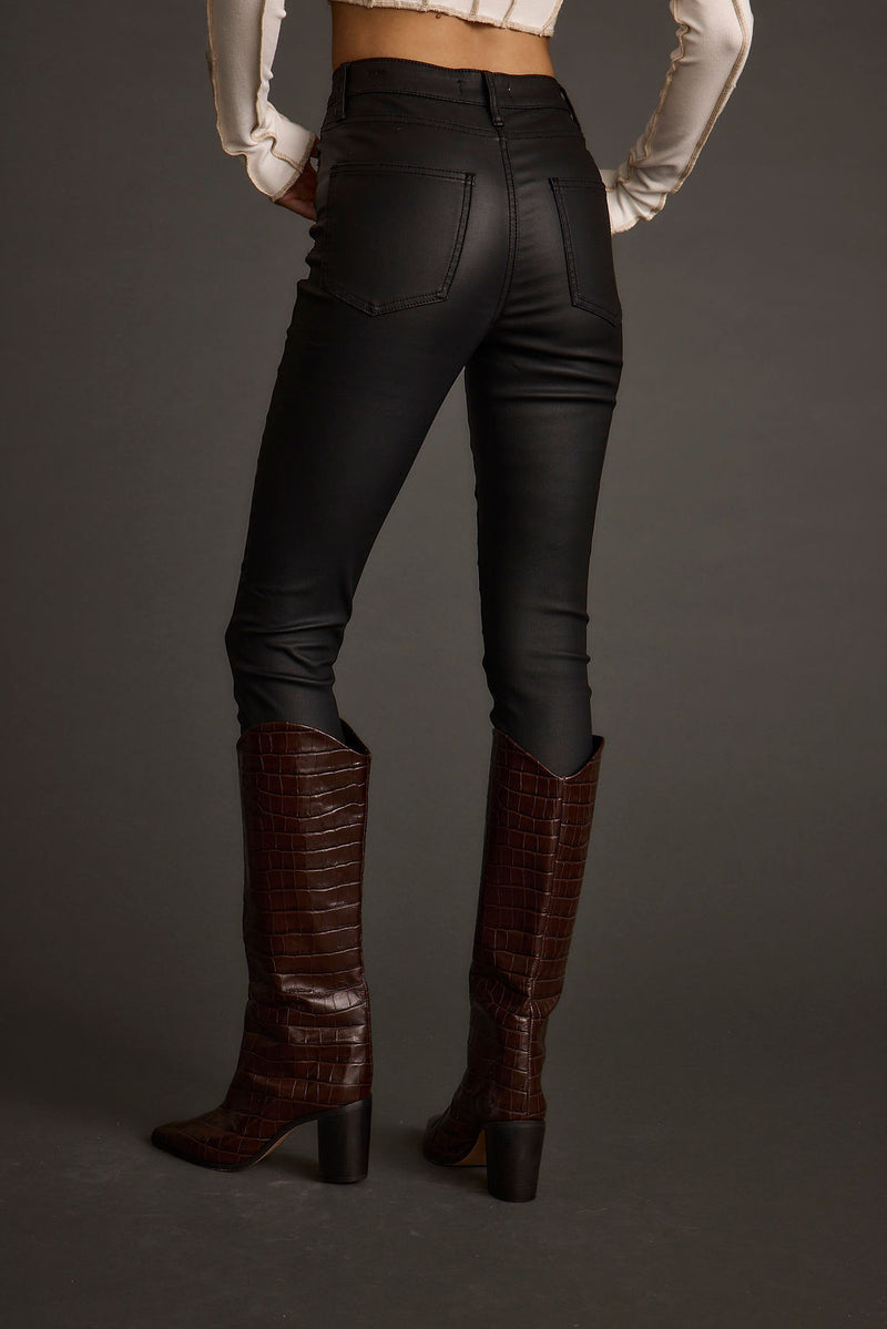 Close-up of the Nixon Black Coated Pants showcasing the fabric texture and design details.