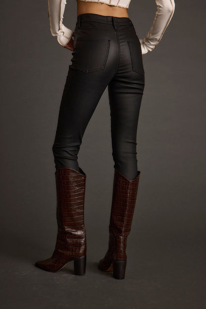 Close-up of the Nixon Black Coated Pants showcasing the fabric texture and design details.