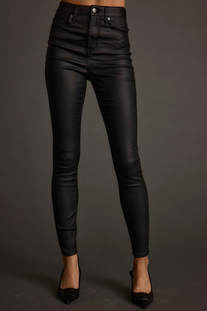 Full-length view of the black pants showing the drape and movement.